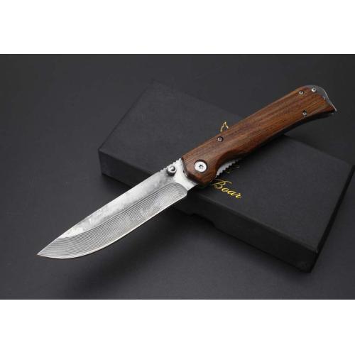 Damascus Boar\'s Tusk Folding Knife