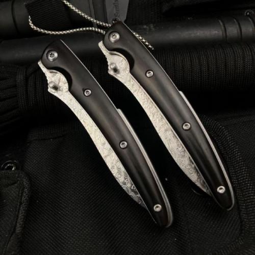 Classic Damascus Folding Knife with an Ebony Handle