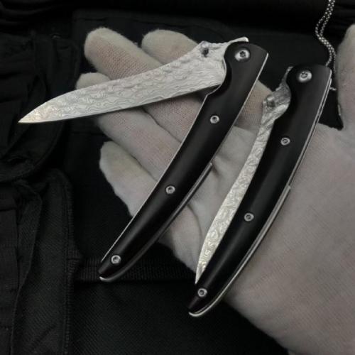 Classic Damascus Folding Knife with an Ebony Handle