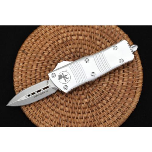 Introducing the Microtech Mini Dragon OTF in the sleek White Edition with a Spear Point blade.