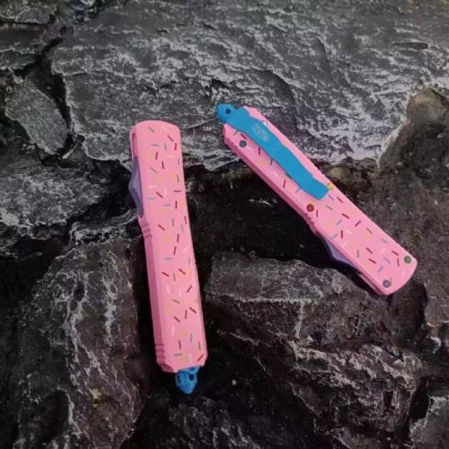 Introducing the Microtech TU85 Donut OTF Knife: a blend of precision engineering and playful design. This knife combines