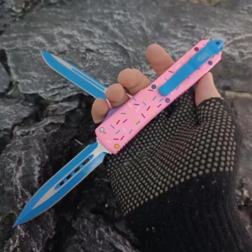 Introducing the Microtech TU85 Donut OTF Knife: a blend of precision engineering and playful design. This knife combines