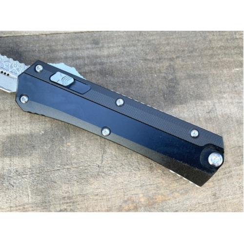 Introducing the New Microtech Troodon OTF Knife with a Damascus G10 Handle.
