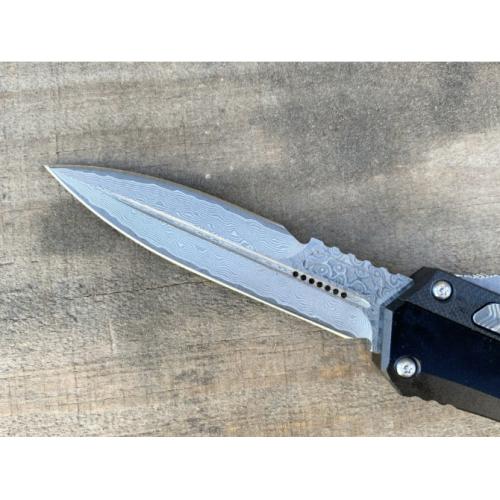 Introducing the New Microtech Troodon OTF Knife with a Damascus G10 Handle.
