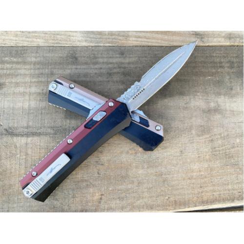 Introducing the New Microtech Troodon OTF Knife with a Damascus Aluminum Handle.