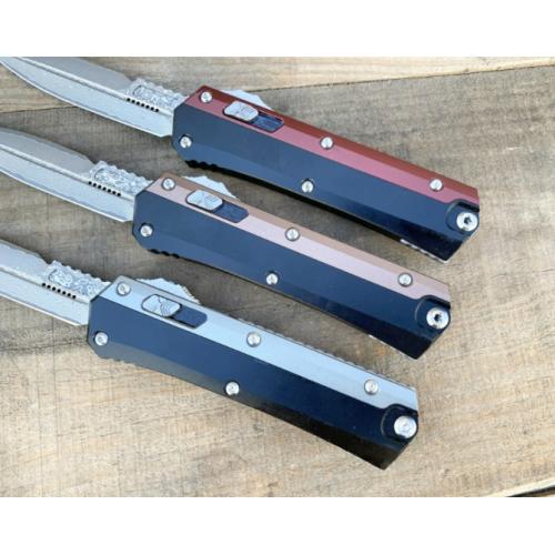 Introducing the New Microtech Troodon OTF Knife with a Damascus Aluminum Handle.