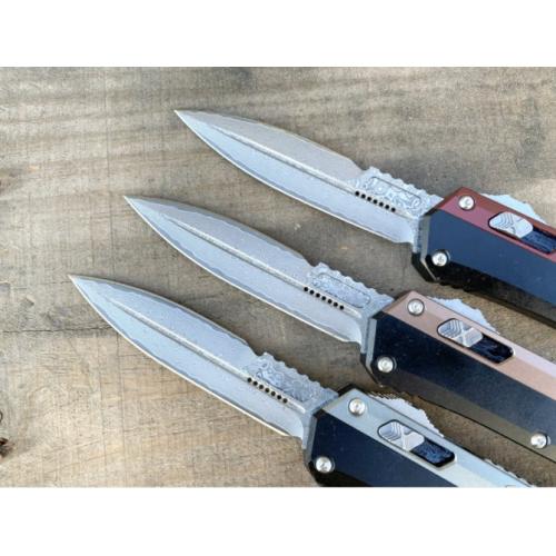 Introducing the New Microtech Troodon OTF Knife with a Damascus Aluminum Handle.