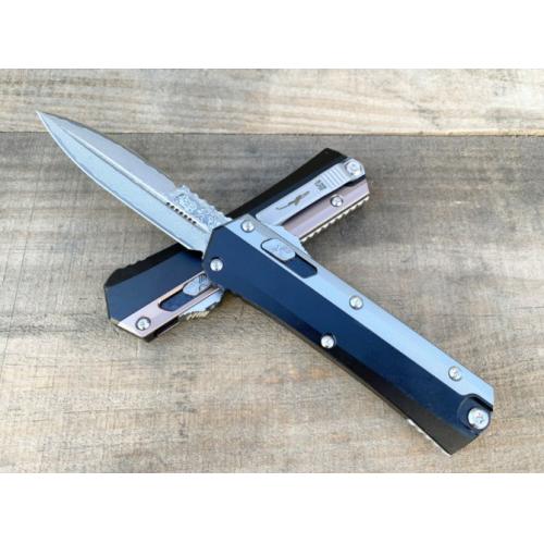 Introducing the New Microtech Troodon OTF Knife with a Damascus Aluminum Handle.