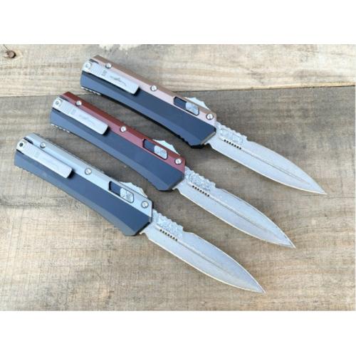 Introducing the New Microtech Troodon OTF Knife with a Damascus Aluminum Handle.