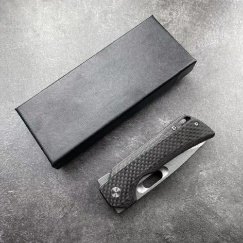 Introducing the JJ102-B Folding Knife, featuring a sleek carbon fiber handle.