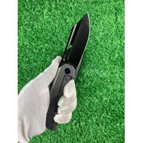 Introducing the new M390 Tyrannosaurus DLC Titanium Folding Knife, featuring a sleek white handle an...