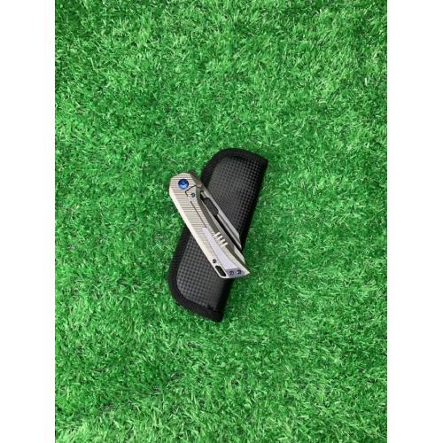 Introducing the new M390 Tyrannosaurus DLC Titanium Folding Knife, featuring a sleek white handle and a striking black b