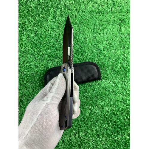 Introducing the new M390 Tyrannosaurus DLC Titanium Folding Knife, featuring a sleek white handle and a striking black b