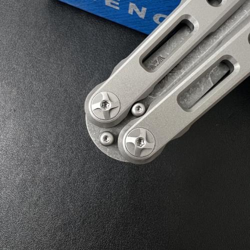 Introducing the Benchmade BM85 Titanium Butterfly Knife, featuring a sleek magnetic latch for seamless operation.