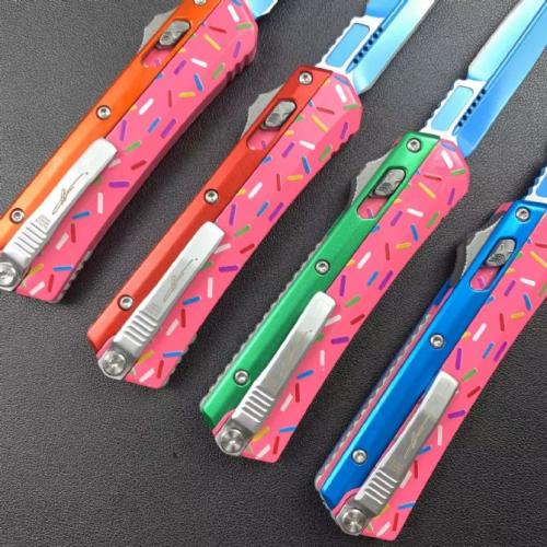 Introducing the Microtech Serpent Donut Large, featuring a sleek zinc-aluminum handle.