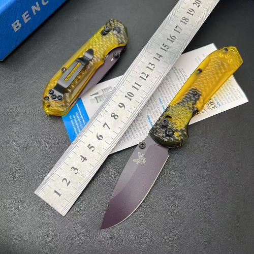 Introducing the new Benchmade Mini Freek 565PL-2501 Folding Knife, featuring a textured transparent ...